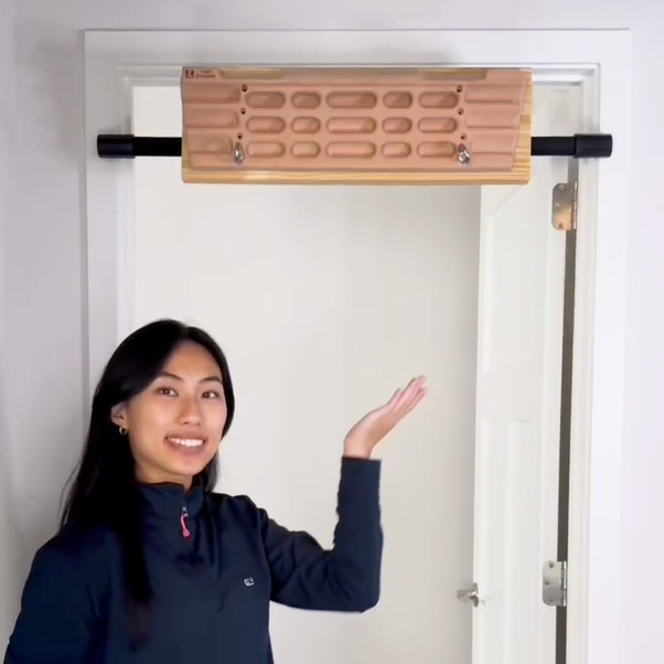 The Silent Mentor on the Wall: How a Hangboard Transforms Ordinary Moments into Extraordinary Strength-E