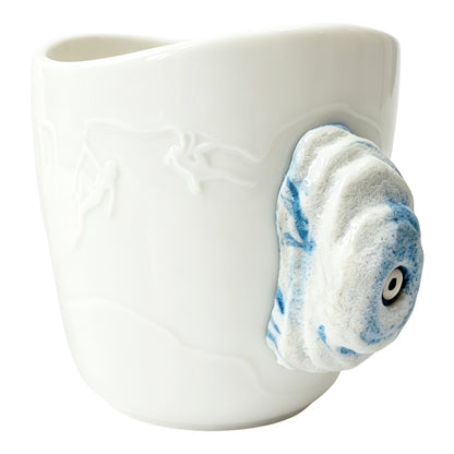 White ceramic rock climbing mug with a 3D blue-speckled climbing hold handle and decorative bolt detail