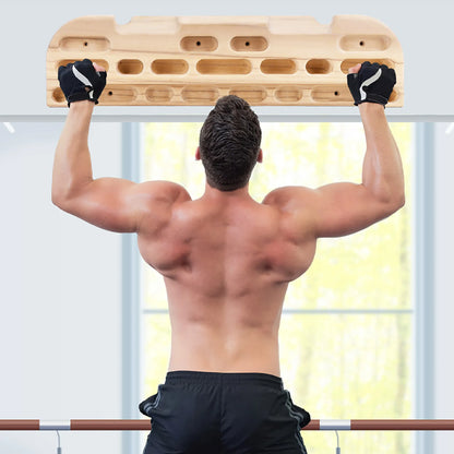Climber training at home using wooden fingerboard hangboard for grip strength and endurance